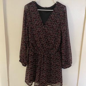 Black, white, and pink, dotted romper. 100% polyester.